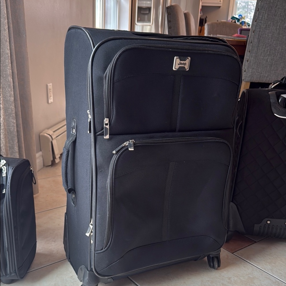 Jeep Black Travel Bag with Wheels and Durable Design